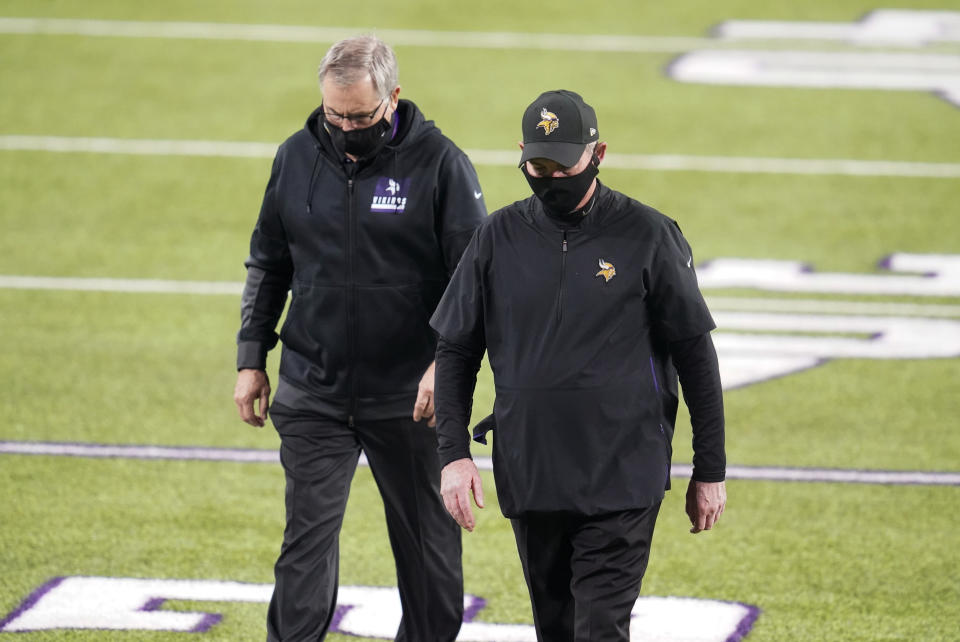 Minnesota Vikings head coach Mike Zimmer, right, walks off the field after an NFL football game against the Dallas Cowboys, Sunday, Nov. 22, 2020, in Minneapolis. The Cowboys won 31-28. (AP Photo/Jim Mone)