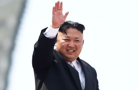 FILE PHOTO: North Korean leader Kim Jong Un waves to people attending a military parade marking the 105th birth anniversary of country's founding father, Kim Il Sung in Pyongyang, April 15, 2017. REUTERS/Damir Sagolj/File Photo