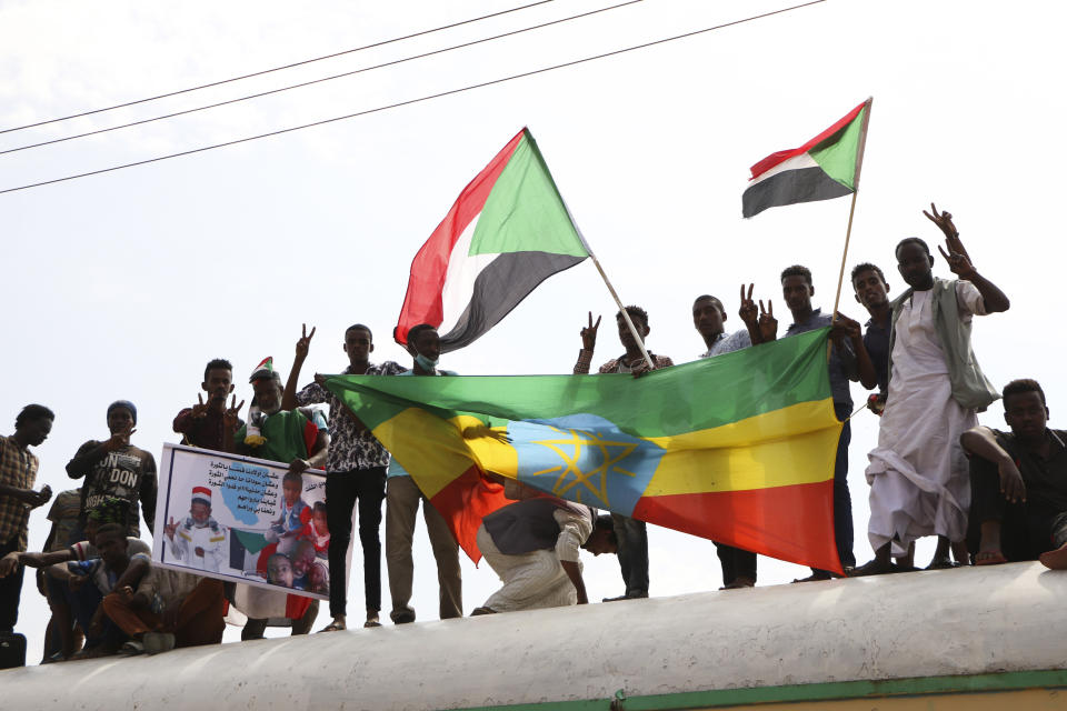 Sudanese pro-democracy supporters celebrate a final power-sharing agreement with the ruling military council Saturday, Aug 17, 2019, in the capital, Khartoum. The deal paves the way for a transition to civilian-led government following the overthrow of President Omar al-Bashir in April. (AP Photo)