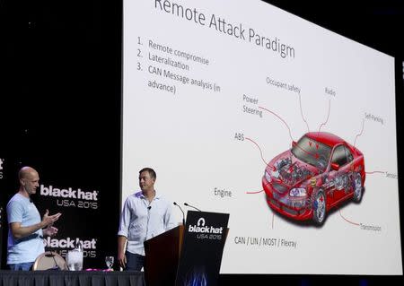 Charlie Miller (L) and Chris Valasek give a briefing during the Black Hat USA 2015 cybersecurity conference in Las Vegas, Nevada August 5, 2015. REUTERS/Steve Marcus/File Photo