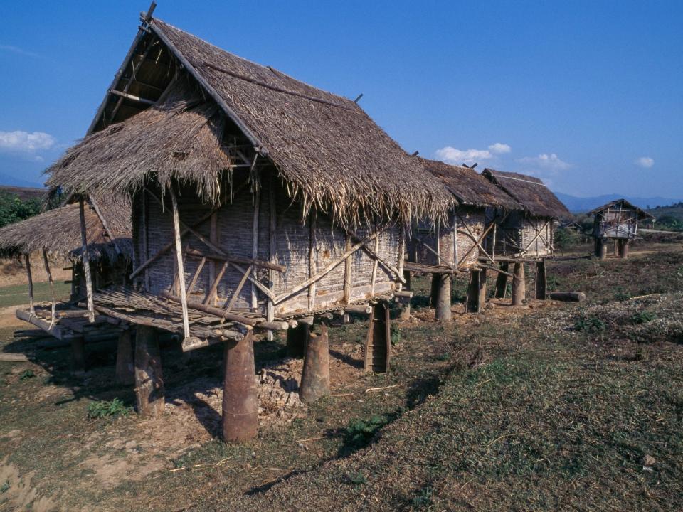 Stilt houses built with American bombs in Laos.