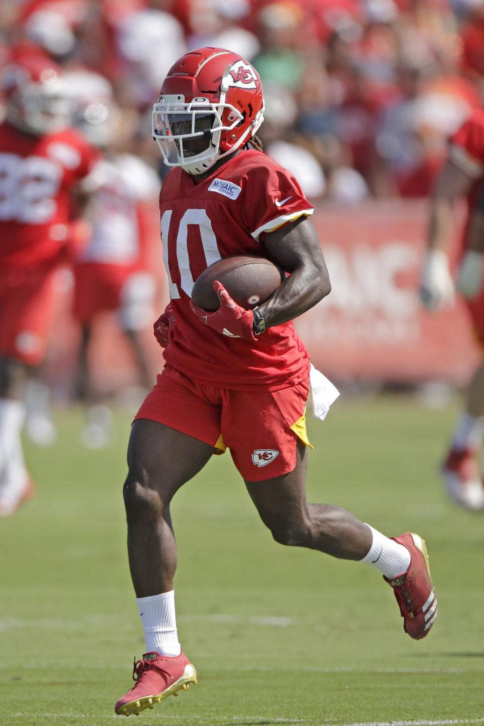 Kansas City Chiefs wide receiver Tyreek Hill runs the ball during NFL football training camp Saturday, July 27, 2019, in St. Joseph, Mo. (AP Photo/Charlie Riedel)