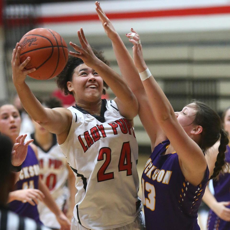 McKinley's Kierstan Bell (24) became the first Ohio girls high school player to be named Ms. Basketball three times. She ended her career as Stark County's career scoring leader with 2,833 points. (CantonRep.com / Scott Heckel)