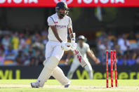 India's Mohammed Siraj is out bowled during play on day three of the fourth cricket test between India and Australia at the Gabba, Brisbane, Australia, Sunday, Jan. 17, 2021. (AP Photo/Tertius Pickard)