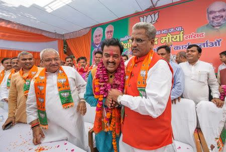 Keshav Prasad Maurya (C) is congratulated by his party members after he was named Bharatiya Janata Party (BJP) chief of Uttar Pradesh state at its party office in Lucknow, India, April 11, 2016. REUTERS/Pawan Kumar