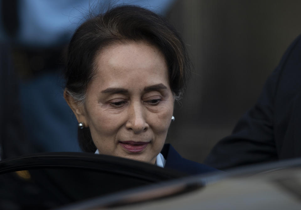 Myanmar's leader Aung San Suu Kyi leaves the International Court of Justice after addressing judges on the second day of three days of hearings in The Hague, Netherlands, Wednesday, Dec. 11, 2019. Aung San Suu Kyi defended Myanmar and denied genocide accusations in a case filed by Gambia at the ICJ, the United Nations' highest court, accusing Myanmar of genocide in its campaign against the Rohingya Muslim minority. (AP Photo/Peter Dejong)