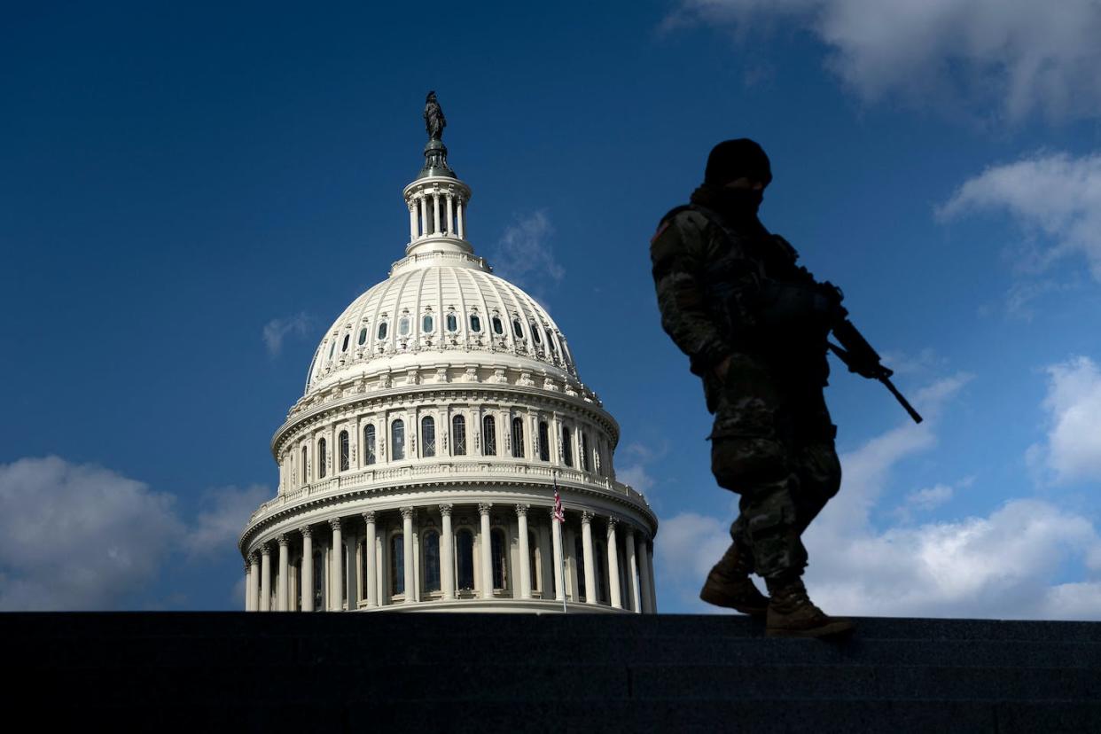 A member of the National Guard patrols the U.S. Capitol on March 4, 2021. <a href="https://media.gettyimages.com/photos/member-of-the-national-guard-patrols-the-grounds-of-the-us-capitol-on-picture-id1231514110?s=612x612" rel="nofollow noopener" target="_blank" data-ylk="slk:Brendan Smialowski/AFP via Getty Images;elm:context_link;itc:0;sec:content-canvas" class="link ">Brendan Smialowski/AFP via Getty Images</a>