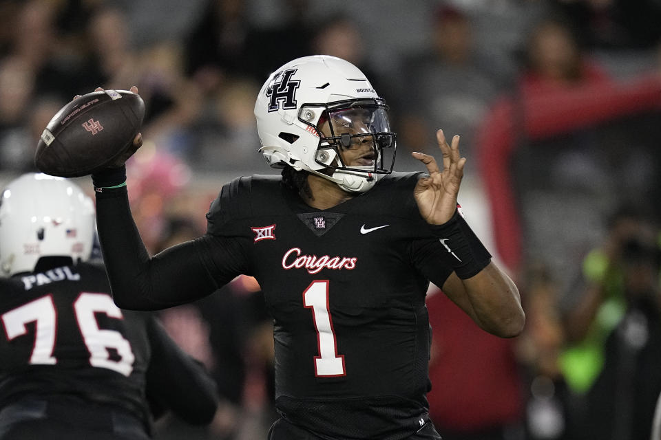 Houston quarterback Donovan Smith throws a pass during the second quarter of the team's NCAA college football game against West Virginia, Thursday, Oct. 12, 2023, in Houston. (AP Photo/Kevin M. Cox)