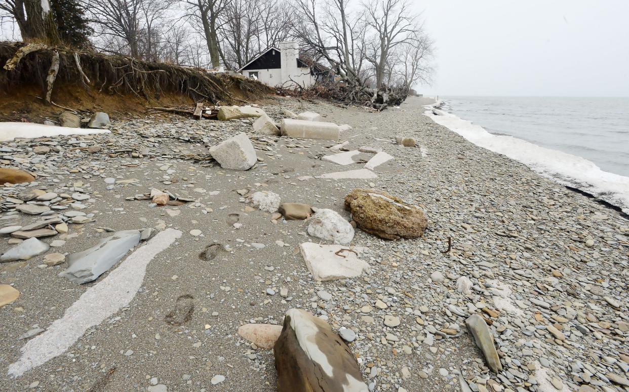 In North East Township, one of the former Dohler cottages, background, on property now being developed as Edgewater, with home sites on beachfront land on Lake Erie.