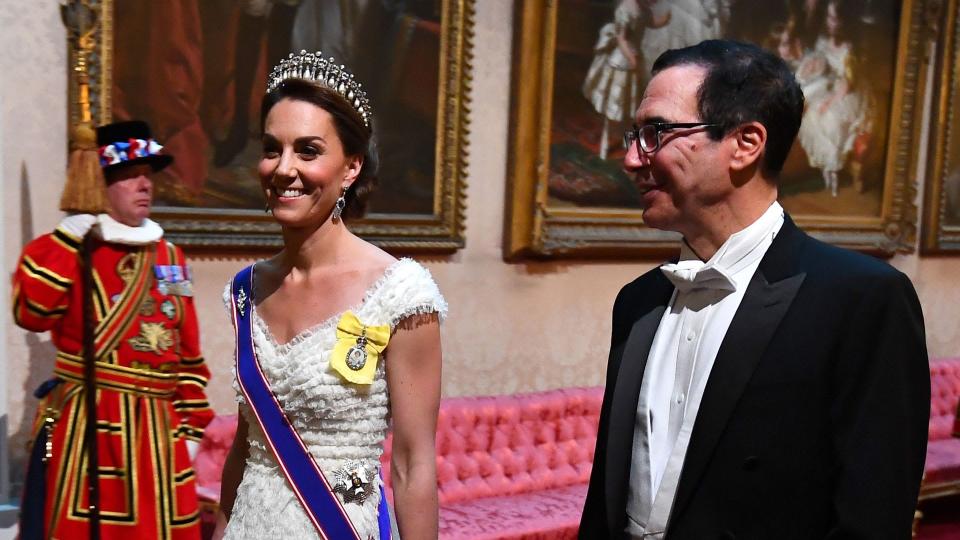 Kate Middleton in a white textured gown and regalia 