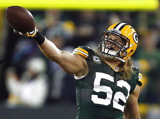 Green Bay linebacker Clay Matthews celebrates after recovering a fumble during the second half of a wild-card playoff game against the Minnesota Vikings.