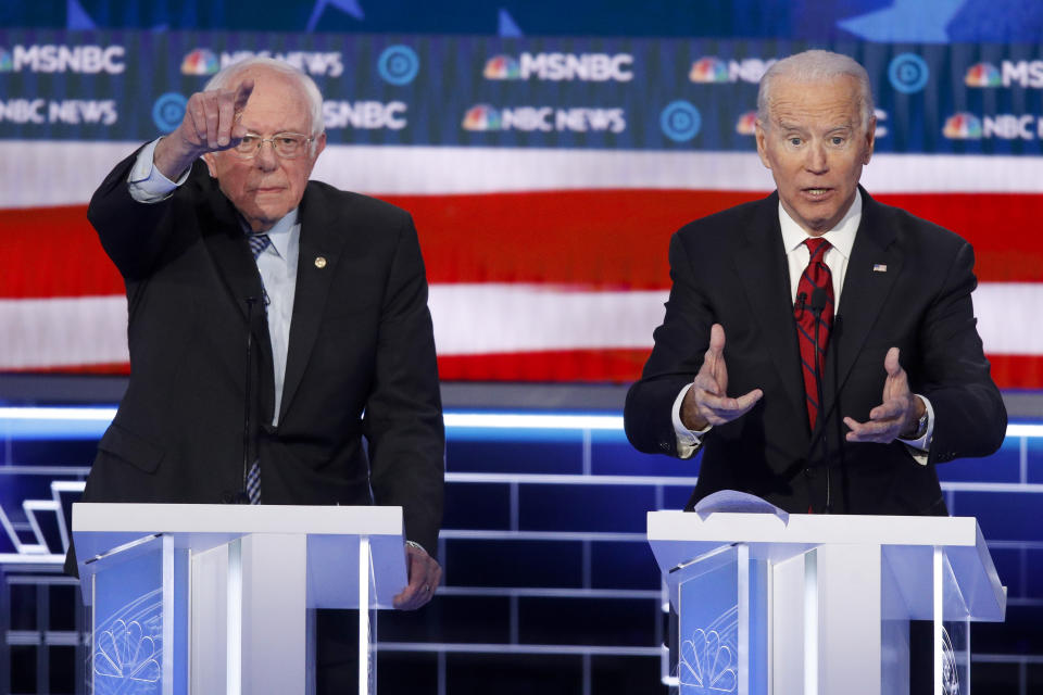 Democratic presidential candidates, Sen. Bernie Sanders, I-Vt., left, and former Vice President Joe Biden gesture during a Democratic presidential primary debate Wednesday, Feb. 19, 2020, in Las Vegas, hosted by NBC News and MSNBC. (AP Photo/John Locher)