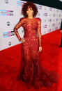 Rated R! The singer wore a risky, red sheer gown by Elie Saab Couture with strategically placed appliqués on the 2010 American Music Awards red carpet.