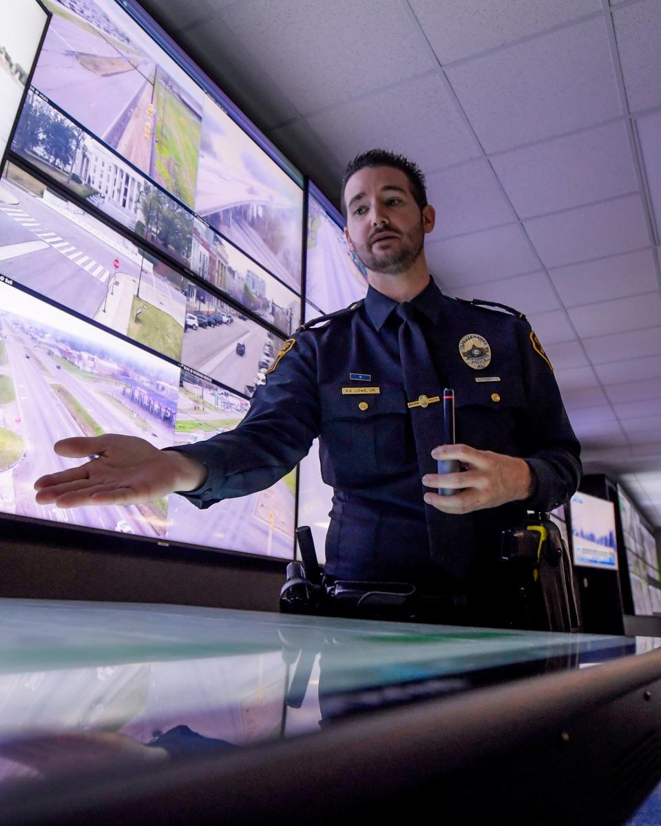 Montgomery Police Lt. D.E. Lowe demonstrates a tabletop monitor in the MPD’s Star Center room during a press conference at the police department in Montgomery, Ala., on Tuesday March 5, 2024.