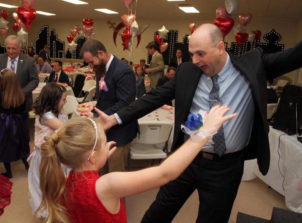 A father and his daughter share a dance at the 9th annual Daddy Daughter Sweetheart Ball held in 2020 at the New Bern Shrine Club.