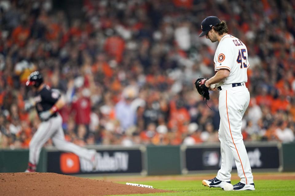 Houston Astros starting pitcher Gerrit Cole reacts after giving up a home run to Washington Nationals' Ryan Zimmerman during the second inning of Game 1 of the baseball World Series Tuesday, Oct. 22, 2019, in Houston. (AP Photo/David J. Phillip)