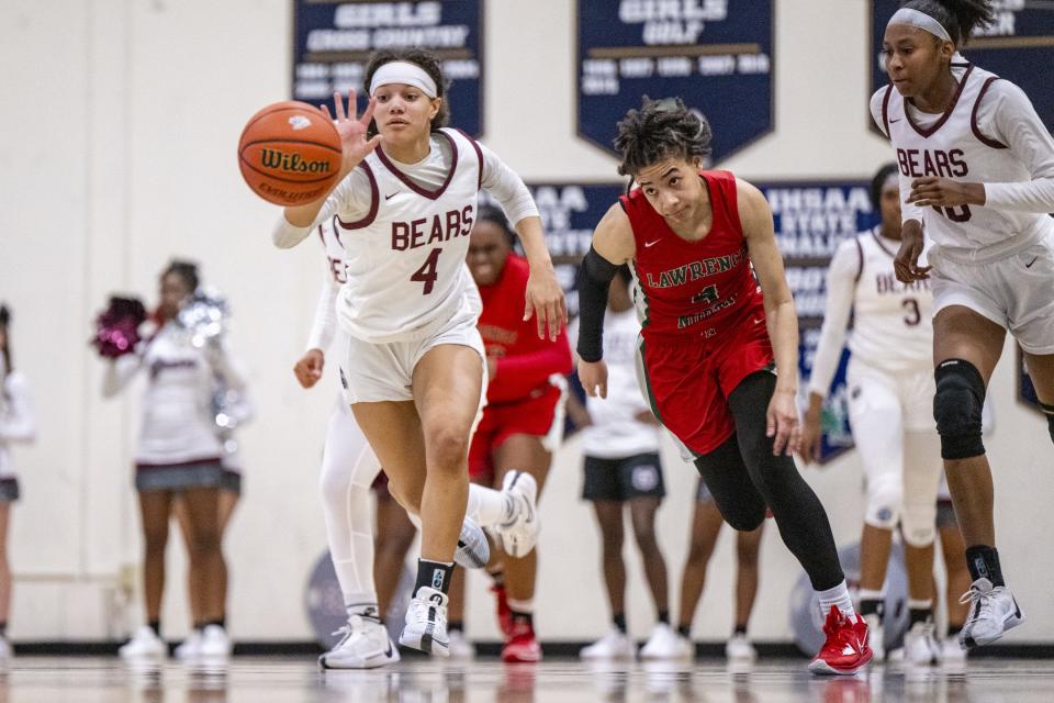 Lawrence Central High School junior Mariah Garrett (4) recovers a loose ball against Lawrence North High School junior Kya Hurt (4) during the first half of an IHSAA Class 4A Sectional semi-final basketball game, Friday, Feb. 2, 2024, at Cathedral High School.