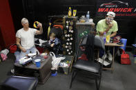 <p>Ringling Bros. boss clown Sandor Eke, left, and Ivan Vargas put on makeup as Eke’s 2-year-old son Michael watches videos on a phone before a performance, Friday, May 5, 2017, in Providence, R.I. “The Greatest Show on Earth” is about to put on its last show on earth. For the performers who travel with the Ringling Bros. and Barnum & Bailey Circus, its demise means the end of a unique way of life for hundreds of performers and crew members. (Photo: Julie Jacobson/AP) </p>