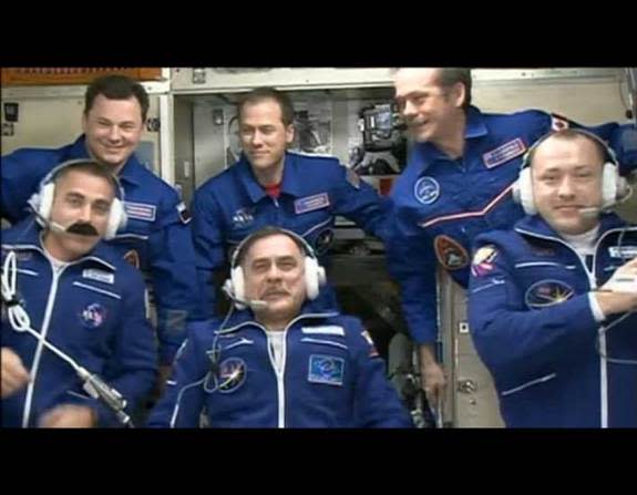 Canadian astronaut Chris Hadfield holds up two objects that look like grenades as part of an April Fools' Day prank today (April 1, 2013).