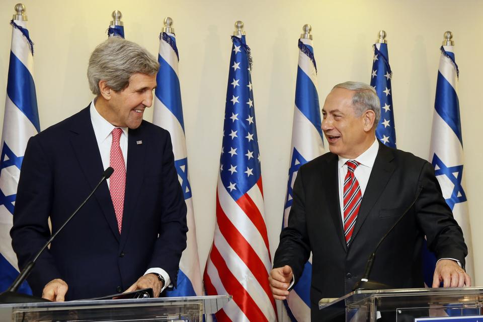 U.S. Secretary of State John Kerry shares a laugh with Israeli Prime Minister Benjamin Netanyahu (R) during a news conference following a meeting at Netanyahu's office in Jerusalem December 5, 2013. Kerry said on Thursday that some progress had been made in Israeli-Palestinian peace talks and that he had presented Israel with ideas for improving its security under any future accord. REUTERS/Gali Tibbon/Pool (JERUSALEM - Tags: POLITICS)