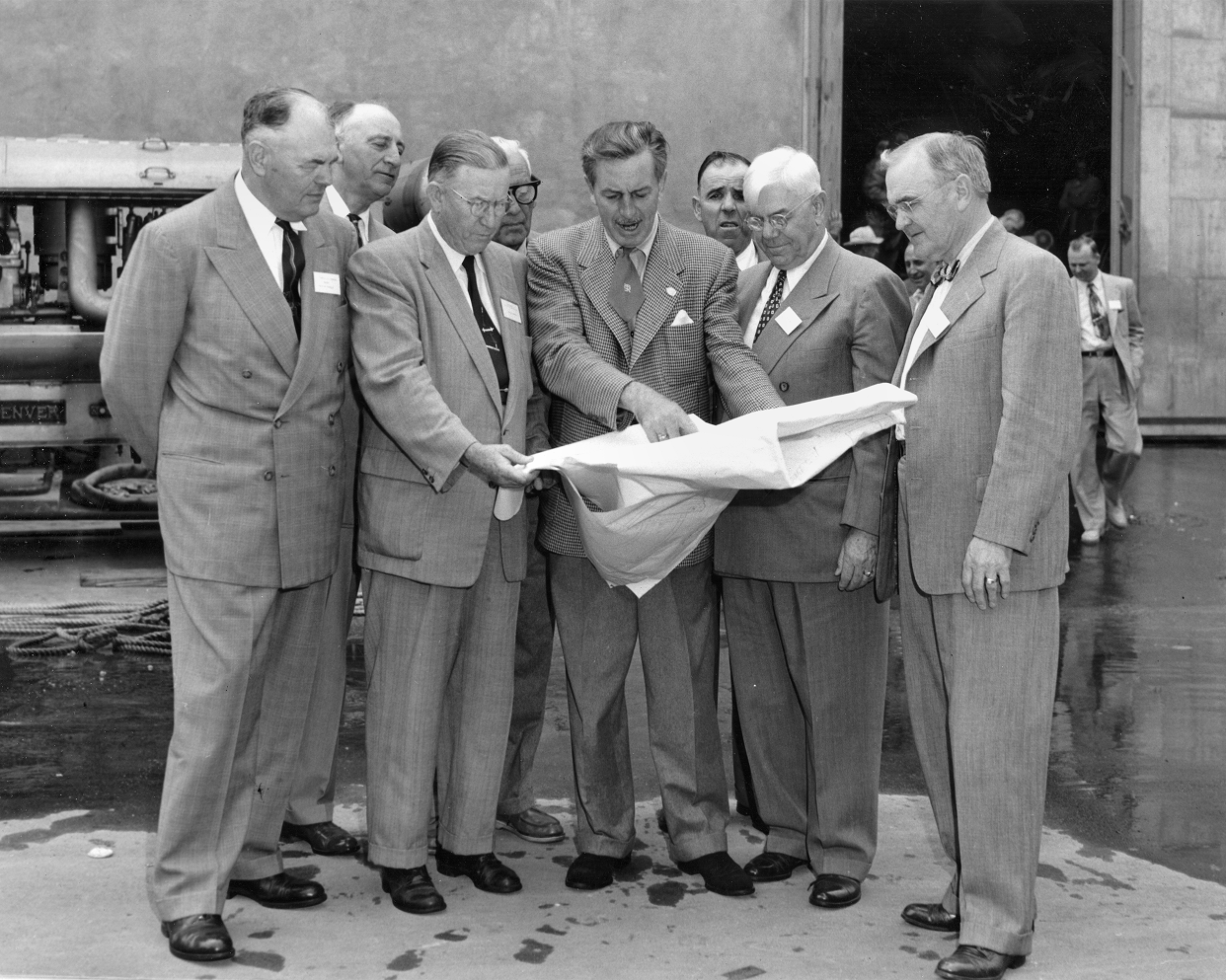 Walt Disney shows Disneyland plans to Orange County officials, Dec. 1954