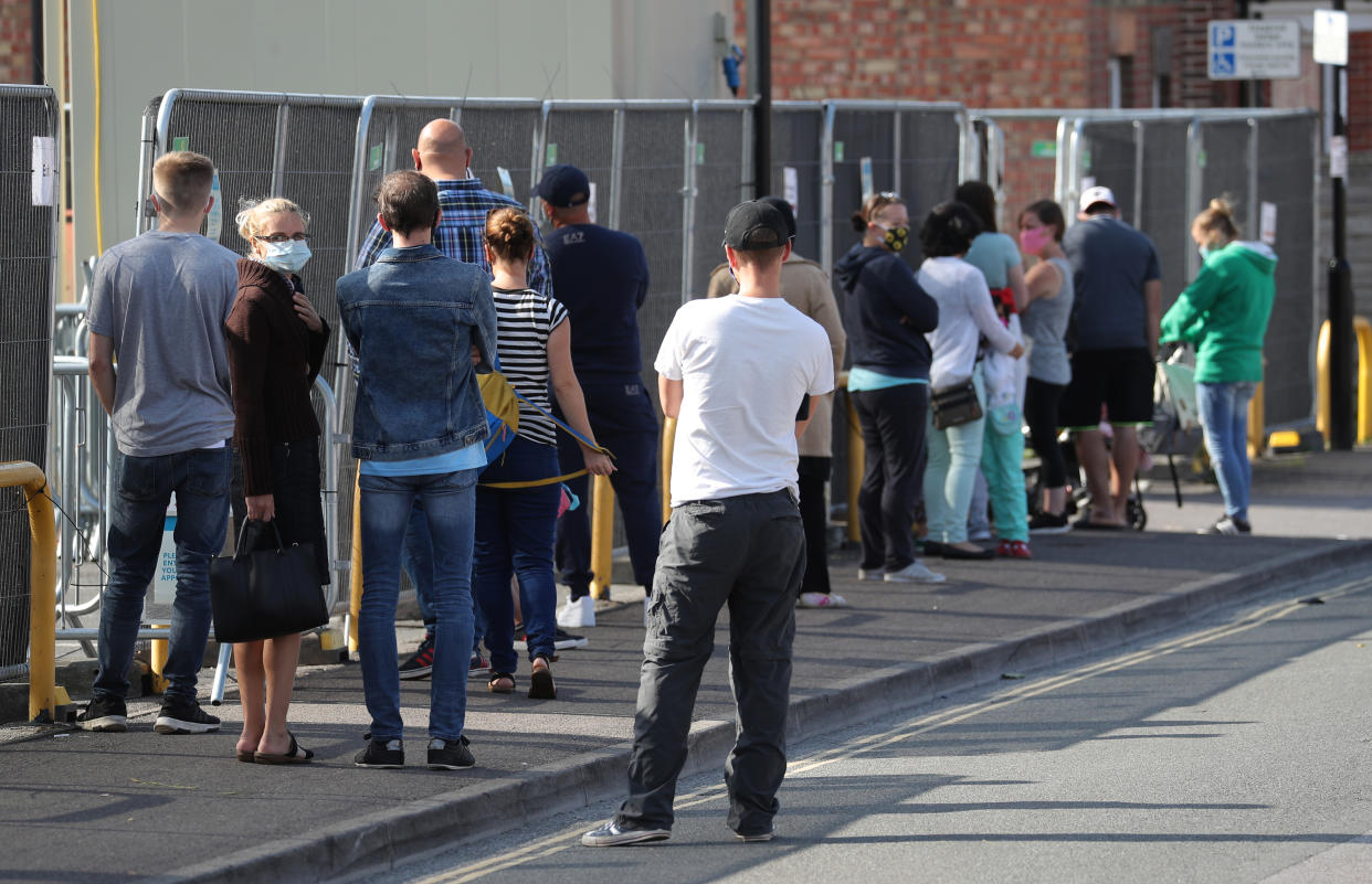 People queue up outside a walk through coronavirus testing centre on Marlborough Road in Southampton. (Photo by Andrew Matthews/PA Images via Getty Images)