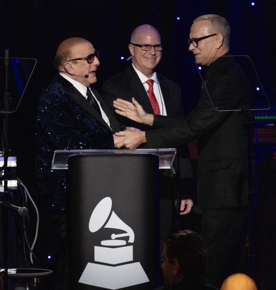 Tom Hanks, introduces Clive Davis during the 66th Grammy Awards Pre-Grammy Gala.