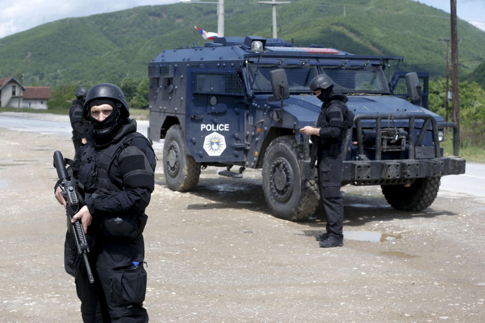 Kosovo police special unit members secure the area near the village of Cabra, north western Kosovo, during an ongoing police operation on Tuesday, May 28, 2019. A Kosovo police operation against organized crime in the north, where most of the ethnic Serb minority lives, has sparked tension, and Serbia ordered its troops to full alert. (AP Photo/Visar Kryeziu)