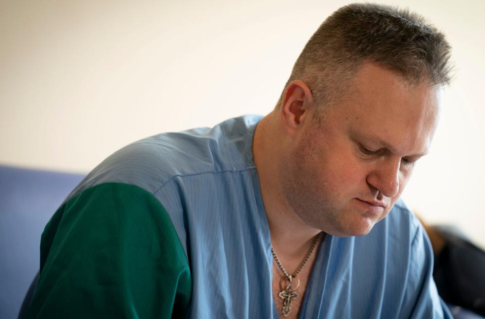 Dr. Artem Posunko, a plastic surgeon from the Regional Medical Center of Family Health in Dnipro, Ukraine, takes a break between surgeries at the Independent Public Health Care Facility in Leczna, Poland, on Thursday, May 18, 2023.