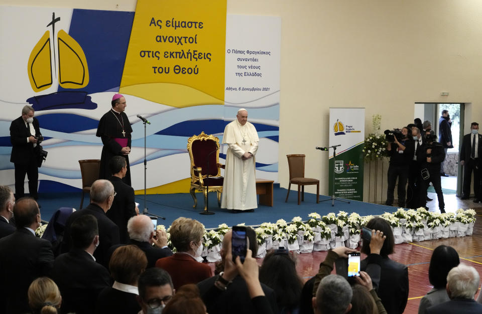 Pope Francis meets young people at the Saint Dionysius School of the Ursuline Sisters in Athens, Greece, Monday, Dec. 6, 2021. Francis' five-day trip to Cyprus and Greece has been dominated by the migrant issue and Francis' call for European countries to stop building walls, stoking fears and shutting out "those in greater need who knock at our door." (AP Photo/Alessandra Tarantino)