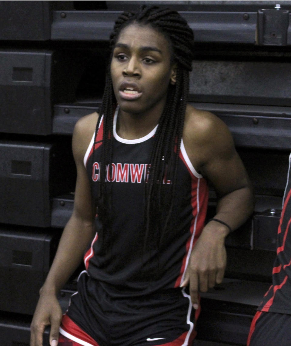 In this Thursday, Feb. 7, 2019 photo, Cromwell High School transgender athlete Andraya Yearwood rests after completing a race during a track meet at Hillhouse High School in New Haven, Conn. Yearwood, a 17-year-old junior at Cromwell High School, is one of two transgender high school sprinters in Connecticut, transitioning to female. (AP Photo/Pat Eaton-Robb)