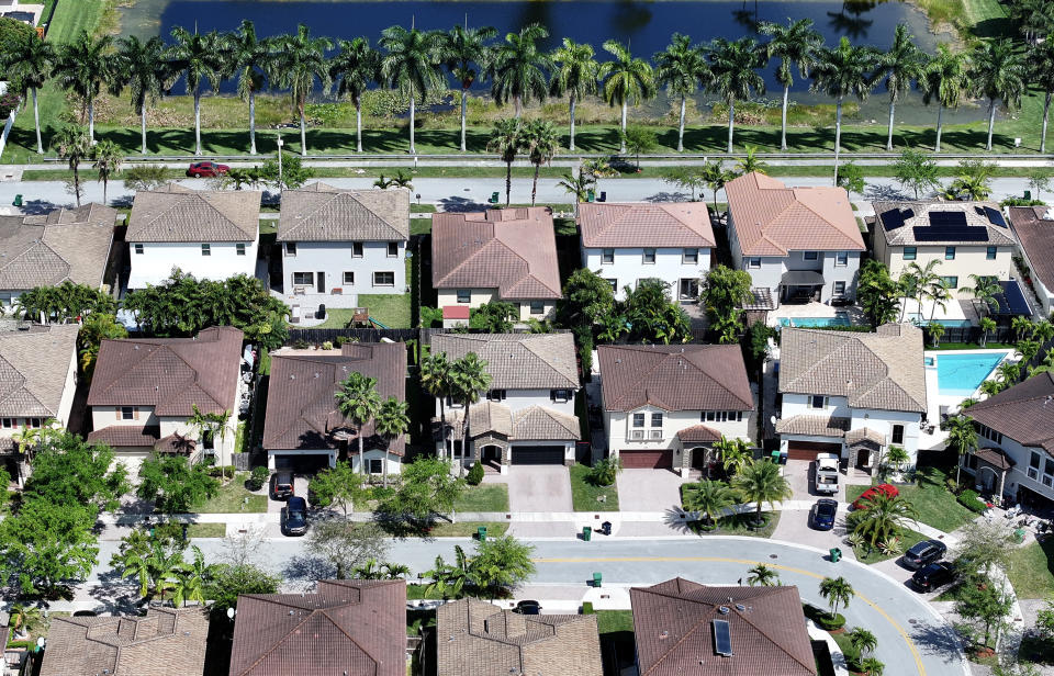 Home prices hit another record in May. (Photo by Joe Raedle/Getty Images)