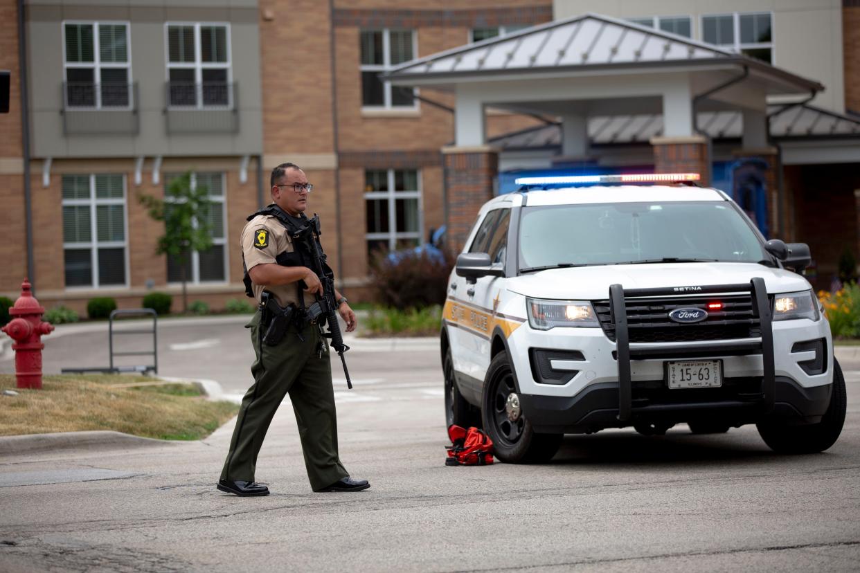 First responders work the scene of a shooting at a Fourth of July parade on July 4, 2022 in Highland Park, Illinois. 