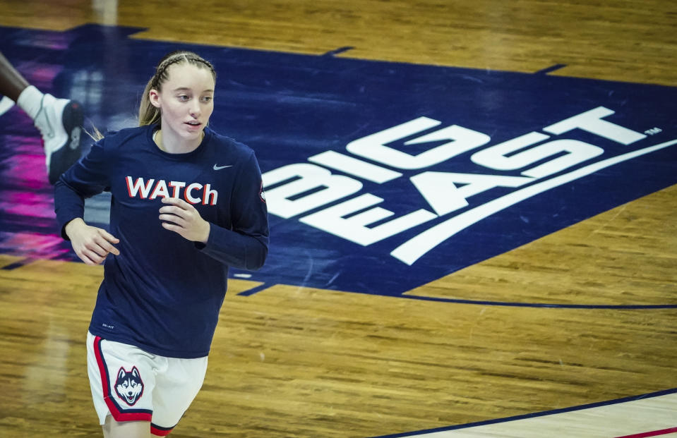 Paige Bueckers in a shirt that reads 