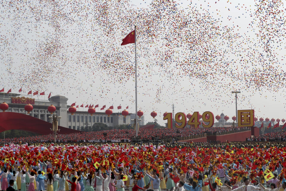 Balloons are released during the 70th anniversary of the founding of the People's Republic of China in Beijing on Tuesday, Oct. 1, 2019. (AP Photo/Ng Han Guan)