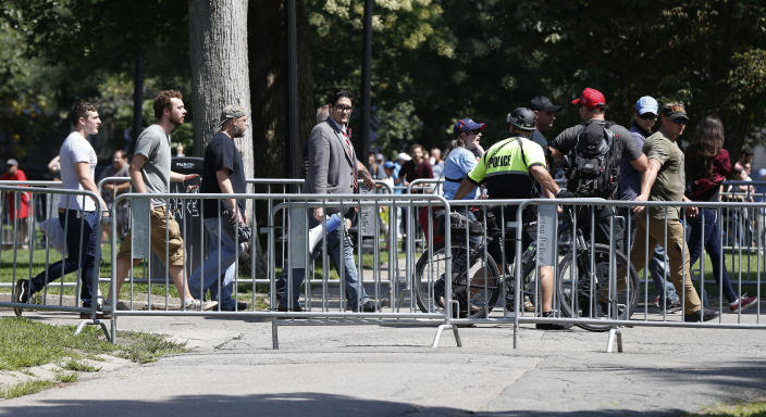 <p>Organizers depart a “Free Speech” rally staged by conservative activists on Boston Common, Saturday, Aug. 19, 2017, in Boston. One of the planned speakers of a conservative activist rally that appeared to end shortly after it began says the event “fell apart.”(Photo: Michael Dwyer/AP) </p>