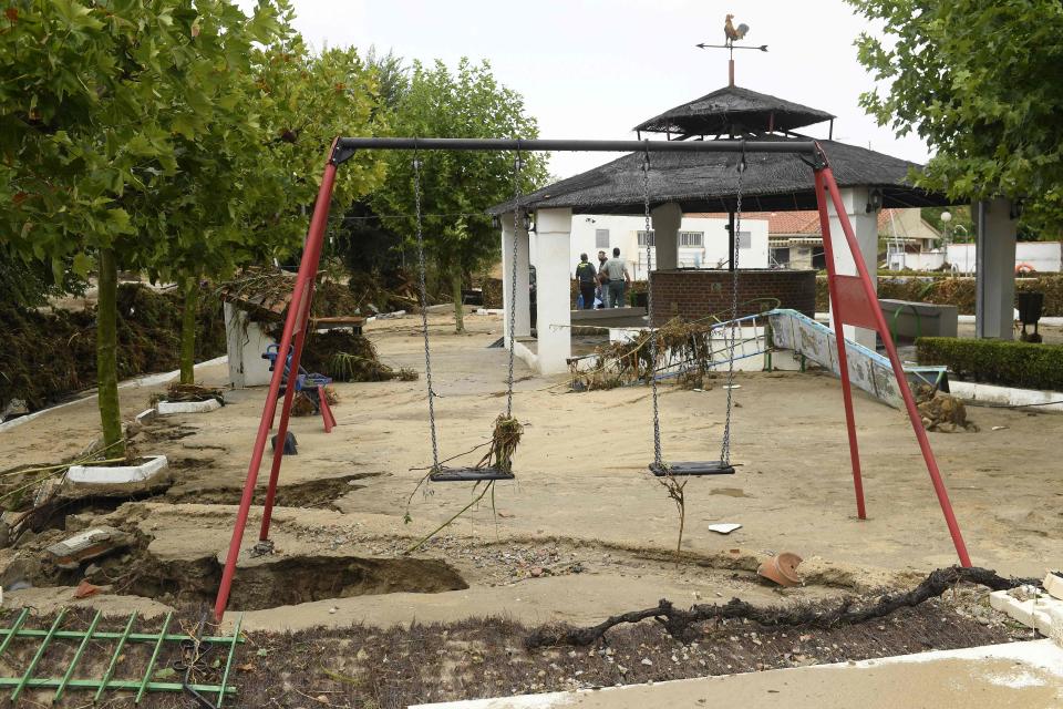A destroyed playground is seen on Monday in the town of Aldea del Fresno in the Madrid region. Spain has been hit by torrential rain that left two people dead and one missing.