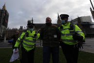 LONDON - UNITED KINGDOM - JANUARY 6: British police arrest demonstrator protesting government's lockdown decision imposed to stem coronavirus (Covid-19) pandemic outside the House of Commons in London, United Kingdom on January 6, 2021. (Photo by Tayfun Salci/Anadolu Agency via Getty Images)