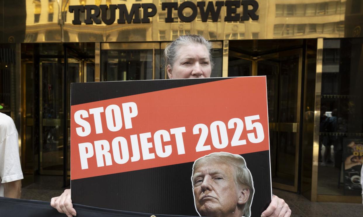 <span>An anti-Trump protester at the entrance to Trump Tower in New York City on 10 July.</span><span>Photograph: Gina M Randazzo/ZUMA Press Wire/REX/Shutterstock</span>