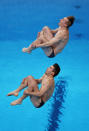 <p>TOKYO, JAPAN - JULY 28: Daniel Goodfellow and Jack Laugher of Team Great Britain compete during the Men's Synchronised 3m Springboard final on day five of the Tokyo 2020 Olympic Games at Tokyo Aquatics Centre on July 28, 2021 in Tokyo, Japan. (Photo by Tom Pennington/Getty Images)</p> 