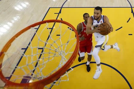 May 26, 2018; Oakland, CA, USA; Golden State Warriors guard Stephen Curry (30) drives to the basket against Houston Rockets forward Trevor Ariza (1) during the first half in game six of the Western conference finals of the 2018 NBA Playoffs at Oracle Arena. Mandatory Credit: John G. Mabanglo/Pool Photo via USA TODAY Sports