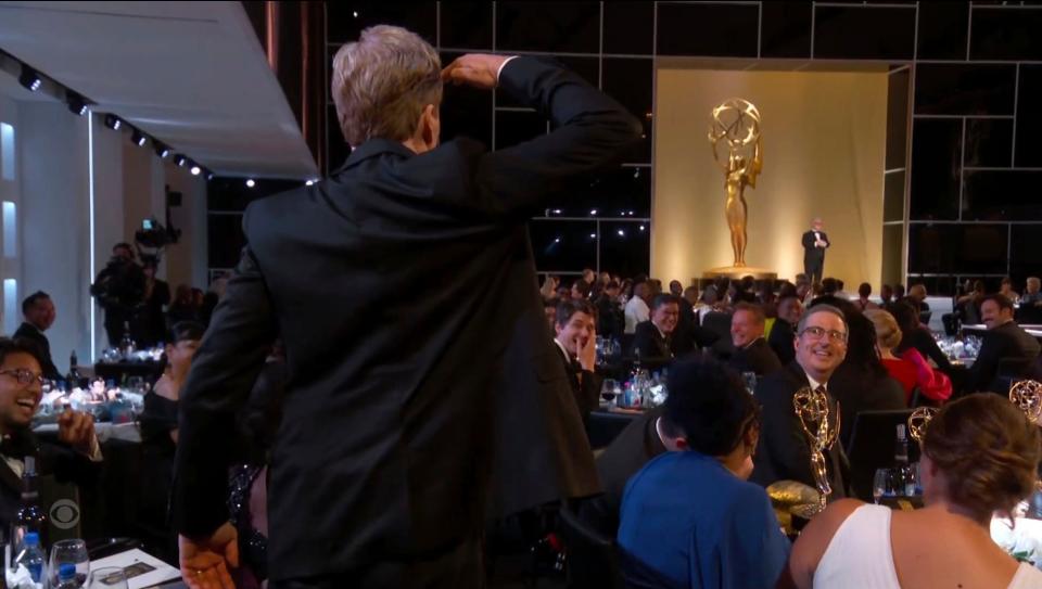 Conan O'Brien salutes Television Academy Chairman and CEO, Frank Scherma during the Primetime Emmy Awards.