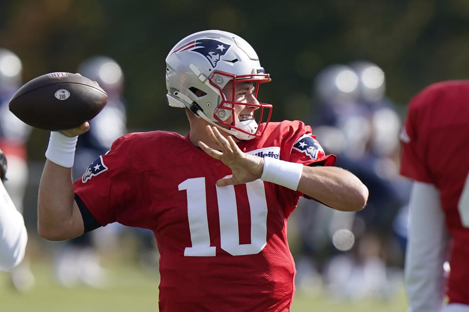 New England Patriots quarterback Mac Jones winds up to pass during an NFL football practice, Wednesday, Oct. 20, 2021, in Foxborough, Mass. (AP Photo/Steven Senne)