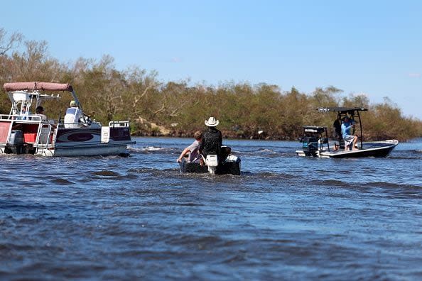 Residents are evacuated from the island by boats on October 2, 2022, in Pine Island, Florida. Residents are being encouraged to leave because the only road onto the island is impassable and electricity and water remain knocked out after Hurricane Ian passed through the area.