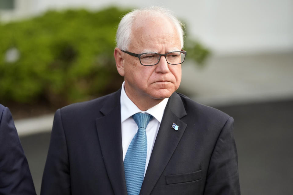 FILE - Minnesota Gov. Tim Walz listens after meeting with President Joe Biden, July 3, 2024, at the White House in Washington. A trademark lawyer who bought the domain named ClintonKaine.com in 2016 is now sitting on HarrisWalz.com as Vice President Kamala Harris narrows in on a running mate. (AP Photo/Jacquelyn Martin, File)