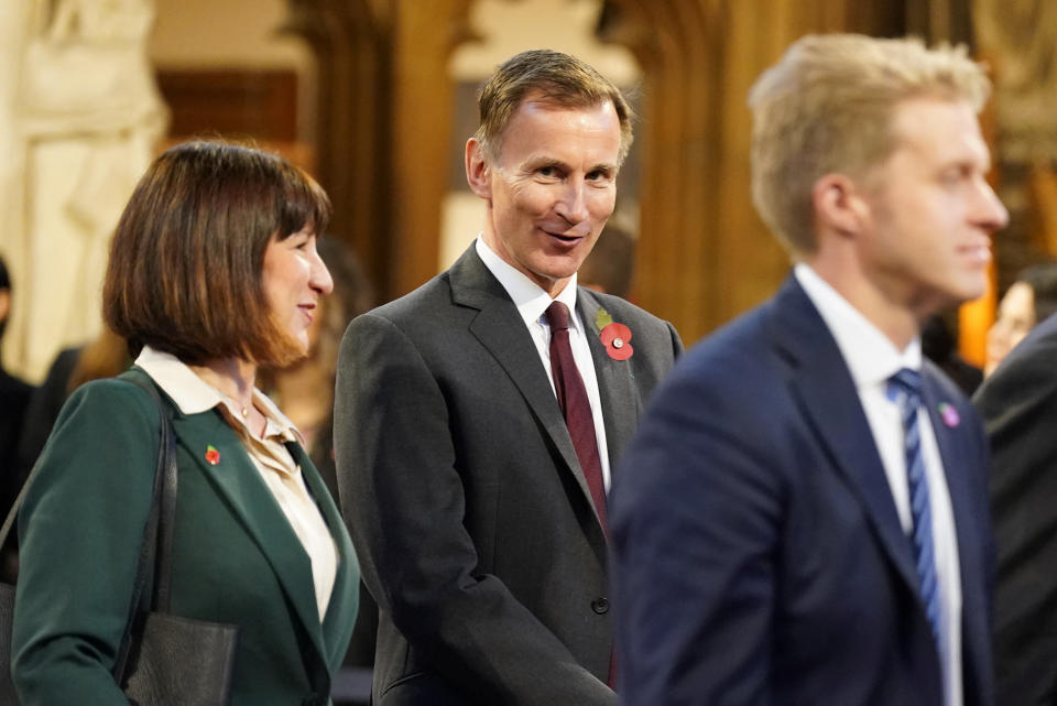 Chancellor of the Exchequer Jeremy Hunt walks with Shadow Chancellor of the Exchequer Rachel Reeves through the Central Lobby at the Palace of Westminster following the State Opening of Parliament in the House of Lords, in London, Britain, November 7, 2023. Stefan Rousseau/Pool via REUTERS