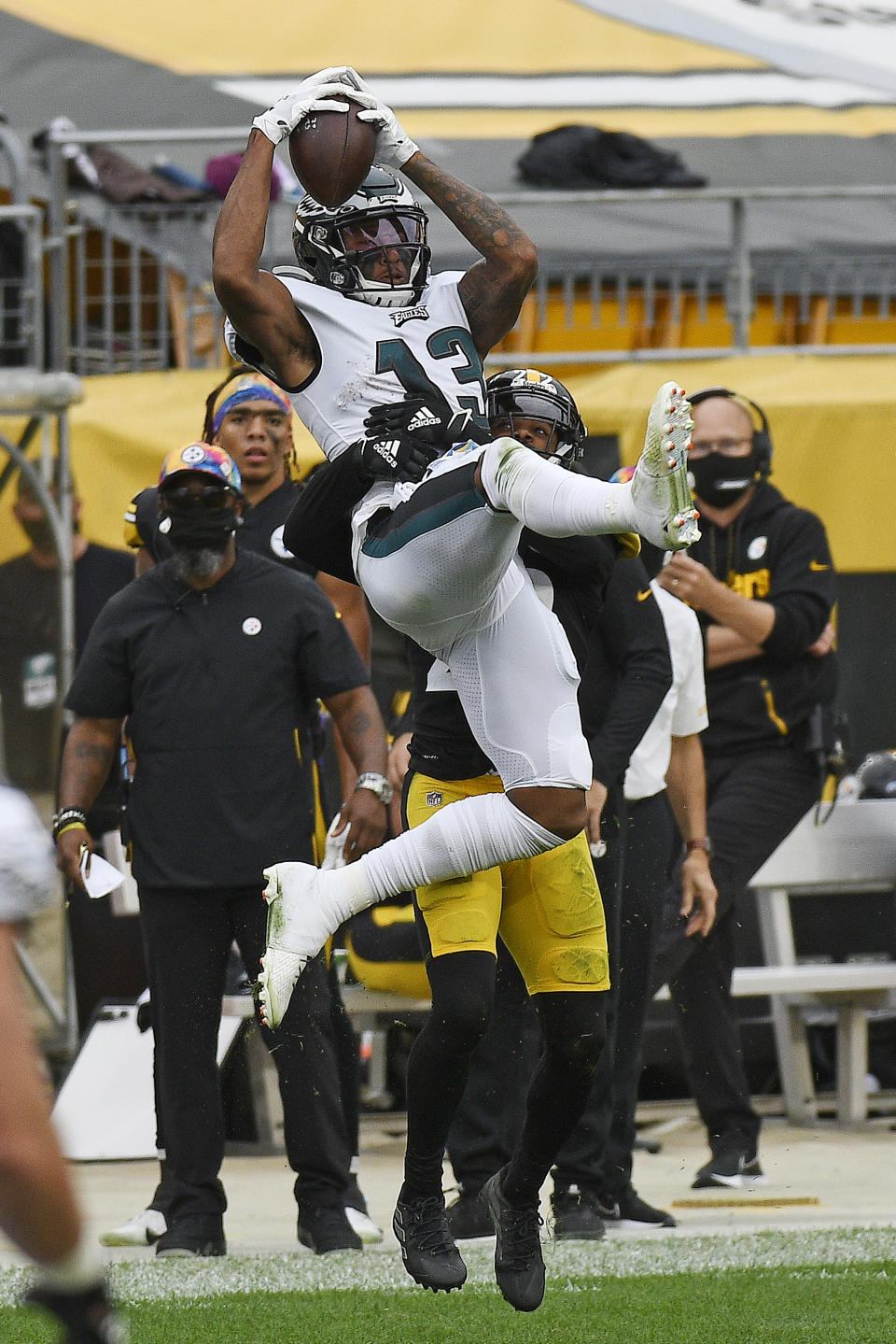 Philadelphia Eagles wide receiver Travis Fulgham (13) makes a catch with Pittsburgh Steelers cornerback Steven Nelson (22) defending during the second half of an NFL football game in Pittsburgh, Sunday, Oct. 11, 2020. (AP Photo/Don Wright)