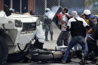 <p>Opposition supporters clash with riot police during a rally against President Nicolas Maduro in Caracas, Venezuela, Venezuela May 3, 2017. (Marco Bello/Reuters) </p>