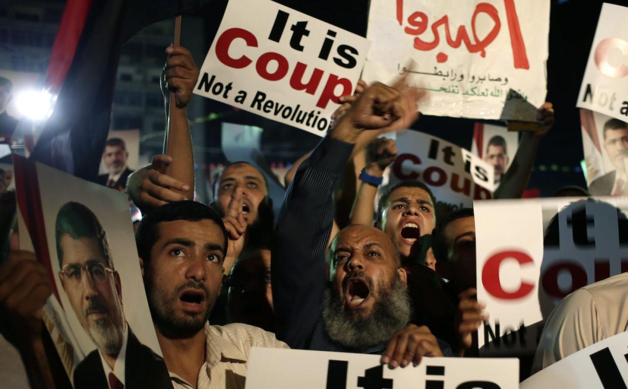 In this July 2013 photo, supporters of Egypt's democratically elected President Mohammed Morsi chant slogans against Egyptian Defense Minister Gen. Abdel-Fattah el-Sissi at Nasr City, in Cairo, Egypt. El-Sissi removed Morsi two weeks earlier with support from the U.S. (AP Photo/Hassan Ammar)