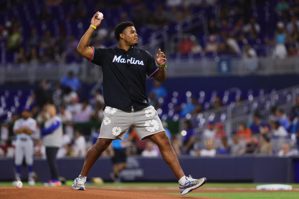 Jul 19, 2024; Miami, Florida, USA; Miami Dolphins linebacker Chop Robinson throws the ceremonial first pitch prior to the game between the Miami Marlins and the New York Mets at loanDepot Park. Mandatory Credit: Sam Navarro-USA TODAY Sports